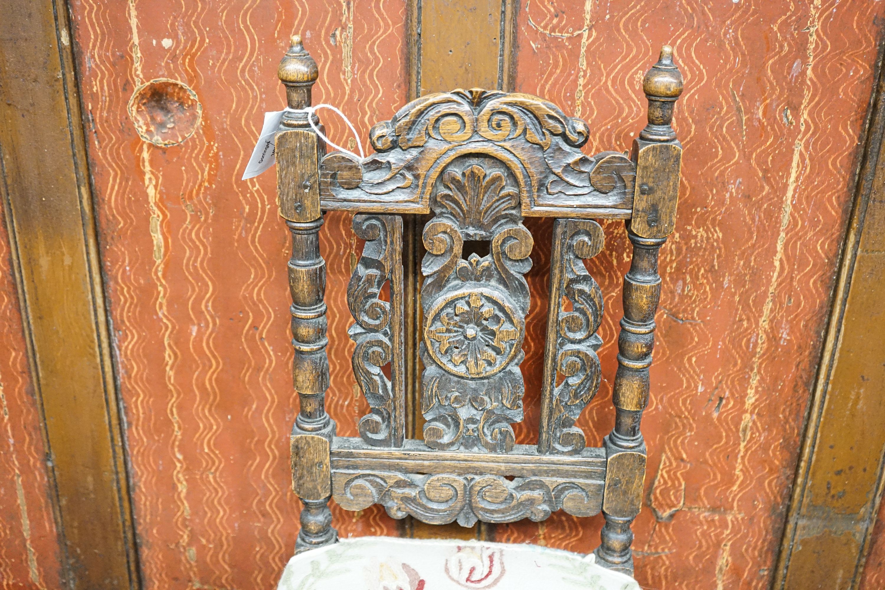 A Carolean style carved oak child's chair, height 70cm
